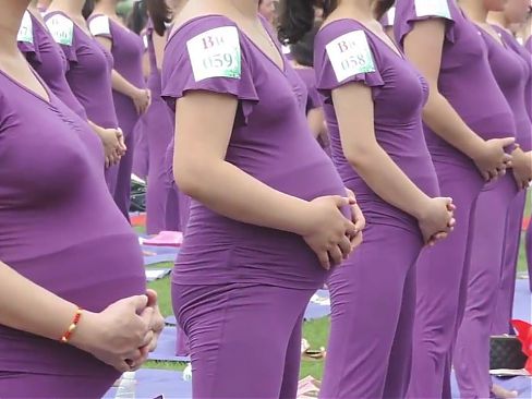 Pregnant Asian women doing yoga (non porn)
